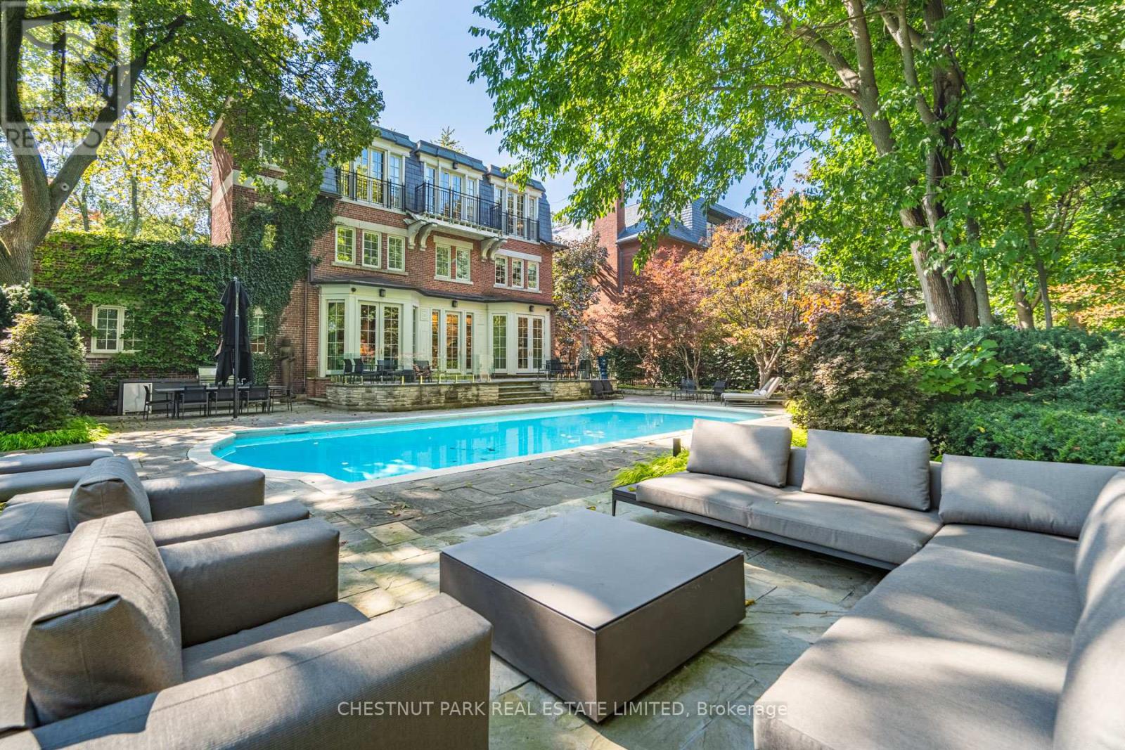 Endless Summer in a Poolside Paradise with 7-Star Resort-Style Luxury! Experience the ultimate retreat in the highly sought-after Rosedale neighborhood, west of Mt. Pleasant. This expansive 85-foot-wide tableland property sits atop the exclusive Chestnut Park ravine, overlooking serene parkland below. A true garden oasis, the stunning oversized pool is virtually irreplaceable in this area, creating an idyllic opportunity for a captivating & private escape. Spanning nearly 8,000 square feet, this elegant Georgian residence is in a picture-perfect position on this magically lamp-lit street just 2 blocks from Yonge. The home features stunning multiple terraces for sitting, dining, and entertaining, complete with an outdoor kitchen. Inside, discover serene, curated interiors & an exceptionally sumptuous primary suite with his & her separate dressing rooms. This trophy property blends timeless grace, alluring charm, & unparalleled privacy with the convenience of everyday luxury in a prized neighborhood. Additional highlights include an ELEVATOR, generator, garage with lift, & ensuite bathrooms in all bedrooms. Set beneath a lush, treed canopy, you are just steps from the subway, top private & public schools, premier shopping, area parks, tennis, skating & hiking & biking trails extending to the lake. Plus, Yorkville & the city center are only a 10-minute drive away. (id:48254)