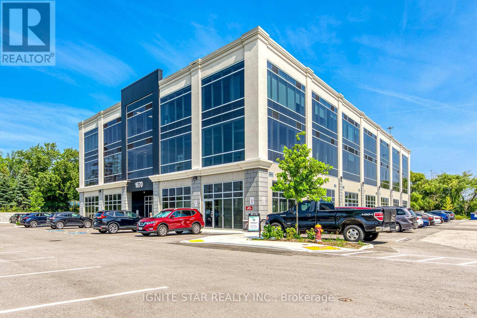 208 - 1670 North Service Road E, Oakville (Qe Queen Elizabeth), Ontario  L6H 7G3 - Photo 1 - W12178963