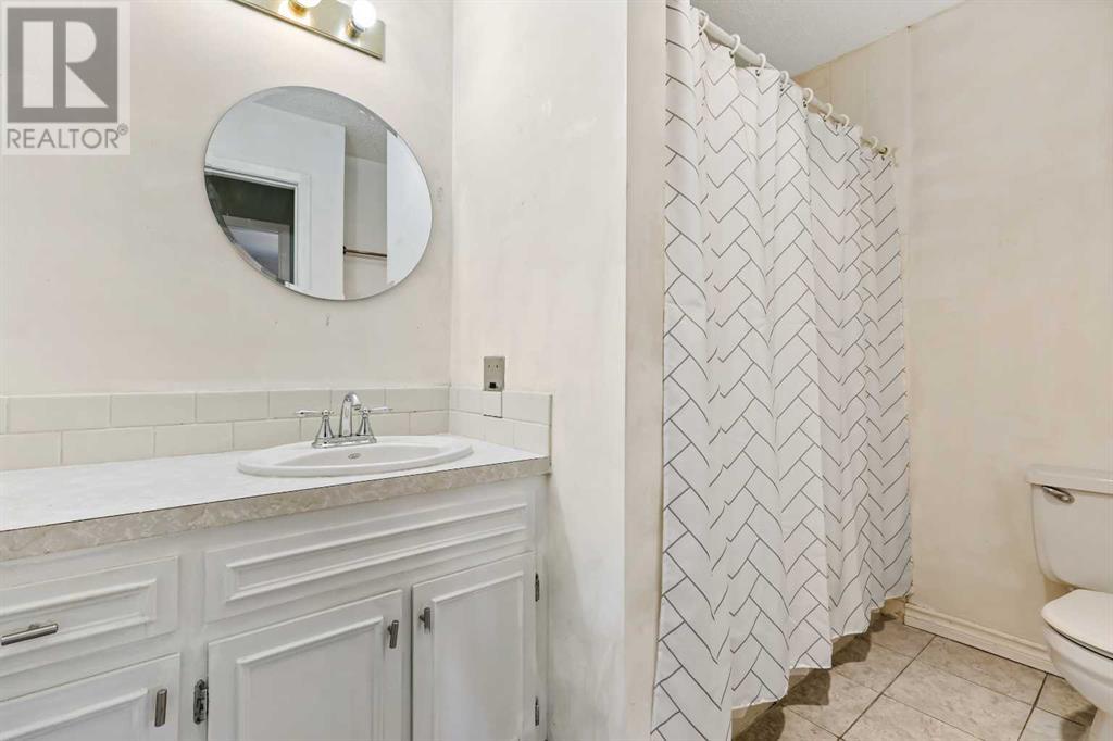 154 Woodglen Grove Sw, Calgary, Alberta  T2W 4S8 - Photo 19 - A2224798