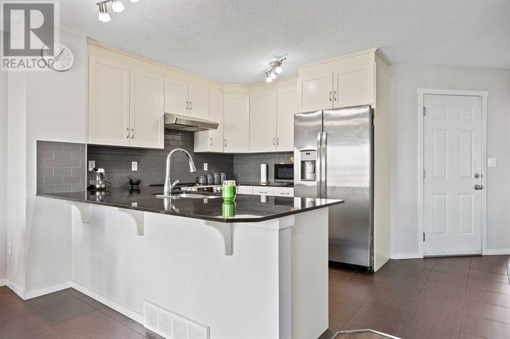 180 Panatella Way Nw, Calgary, Alberta  T3K 0X1 - Photo 6 - A2217410