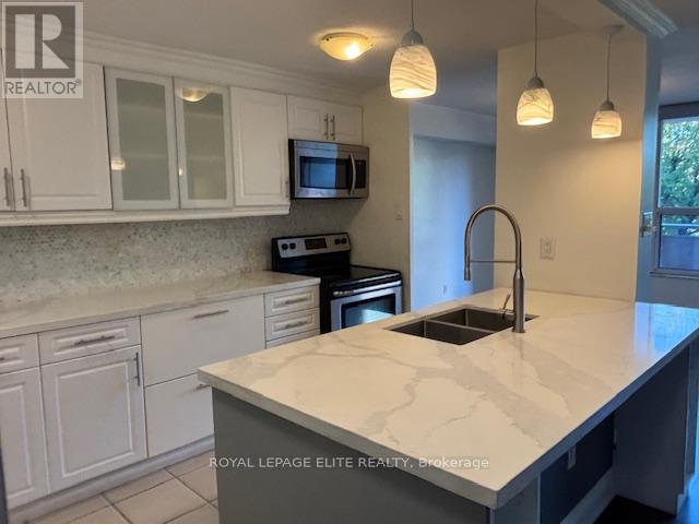 310 - 3120 Kirwin Avenue, Mississauga (Cooksville), Ontario  L5A 3R2 - Photo 4 - W12186079