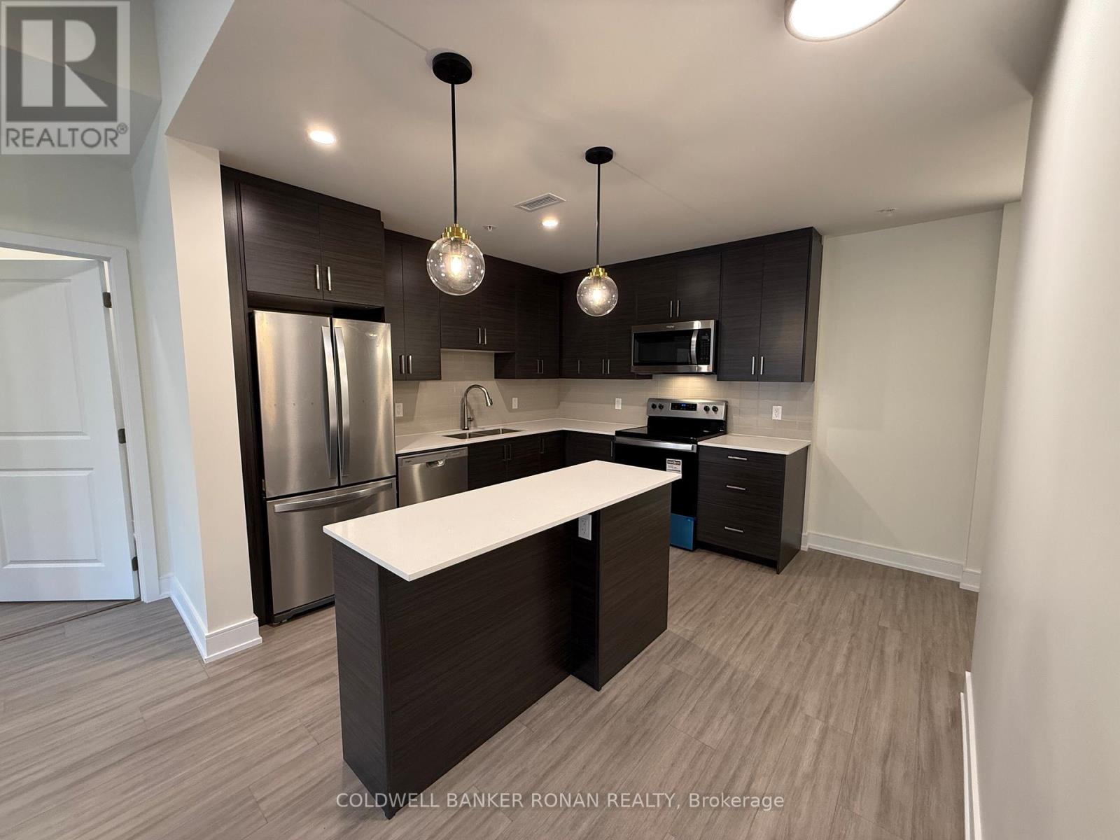 209 - 121 Mary Street, Clearview, Ontario  L0M 1G0 - Photo 1 - S12189357