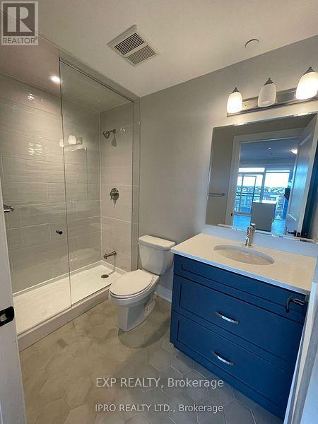 401 - 95 Dundas St Street, Oakville, Ontario  L6M 5N3 - Photo 2 - W12190153