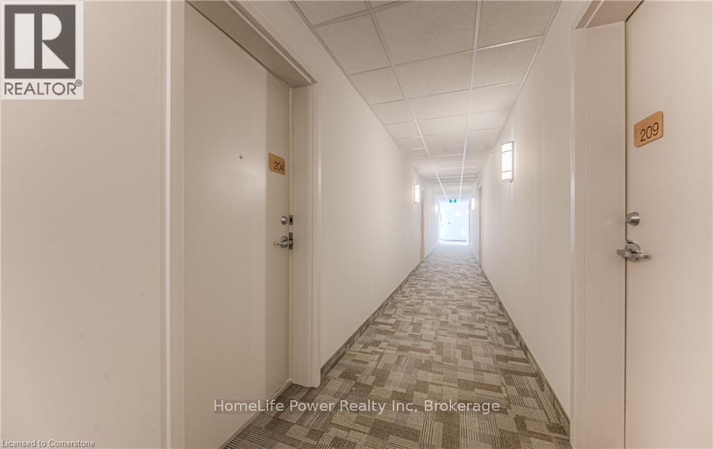 219 - 301 Westmount Road W, Kitchener, Ontario  N2M 5M9 - Photo 4 - X12191788