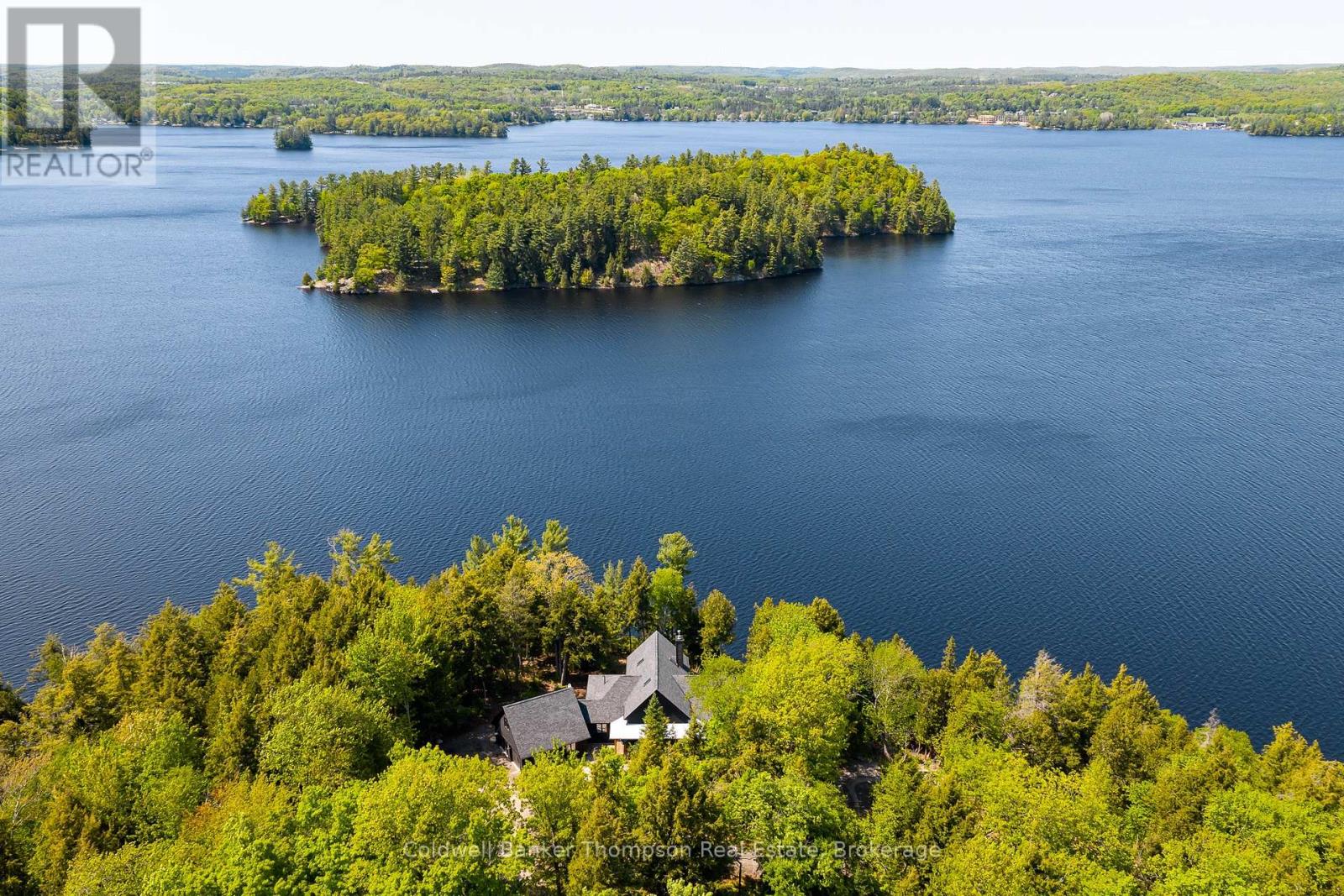 <div class="slider-price">$3,499,900</div><p>59 Waters Edge Lane, Huntsville, Ontario</p>
