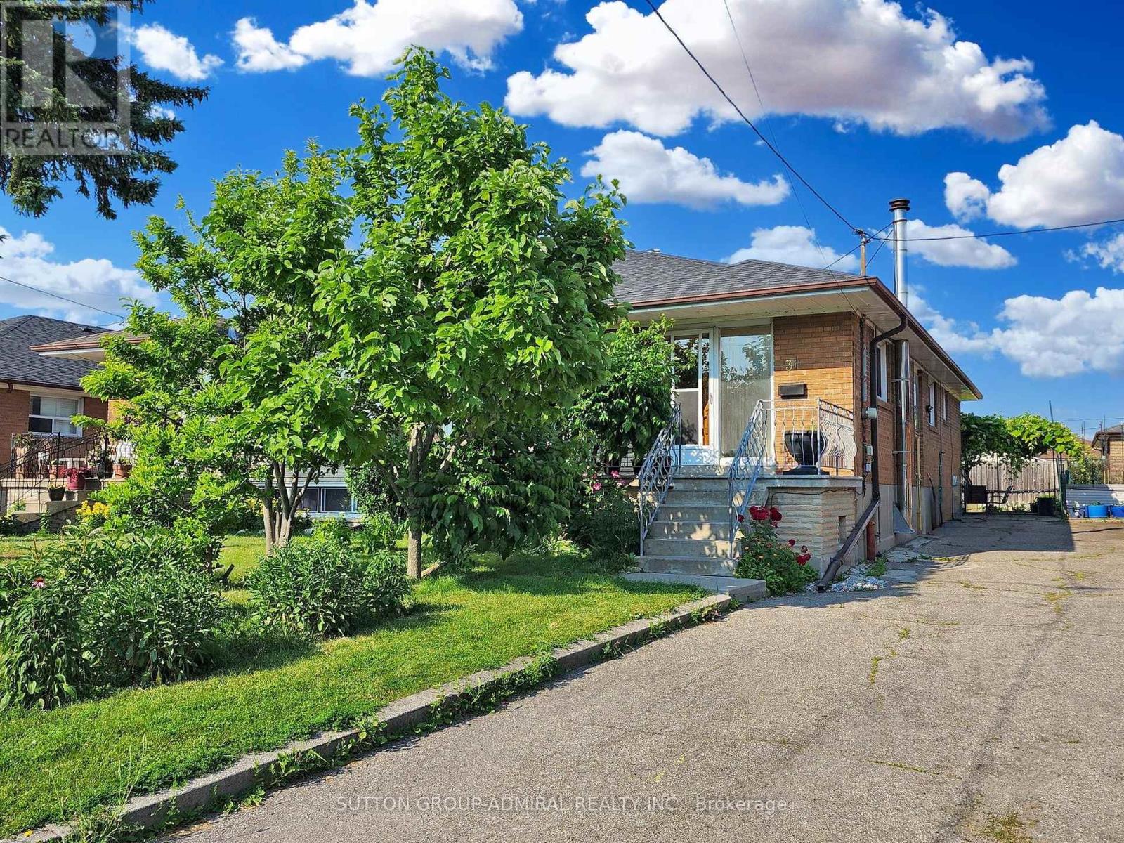 31 Charrington Crescent, Toronto, Ontario  M3L 2C3 - Photo 1 - W12200773