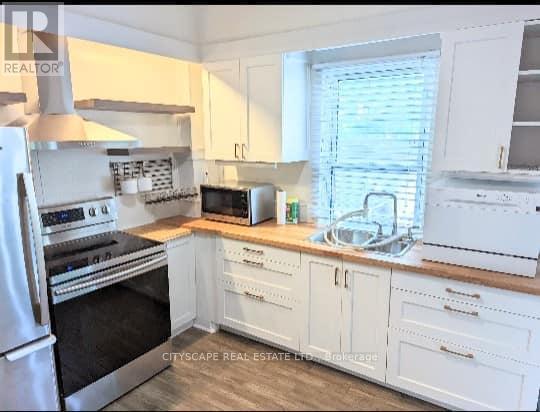 Main Floor & Lower Level - 791 Dufferin Street, Toronto, Ontario  M6H 3K8 - Photo 7 - C12205172