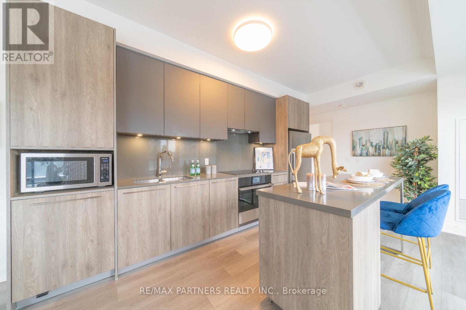 218 - 38 Water Walk Drive, Markham, Ontario  L3R 6M8 - Photo 5 - N12205186