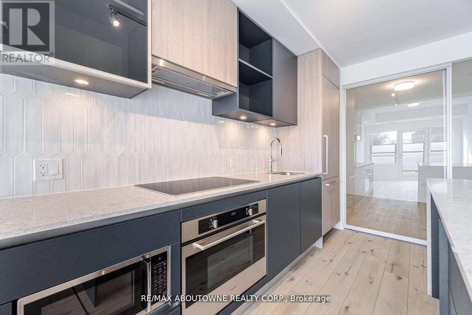 105 - 395 Dundas Street W, Oakville, Ontario  L6M 4M2 - Photo 8 - W12206170