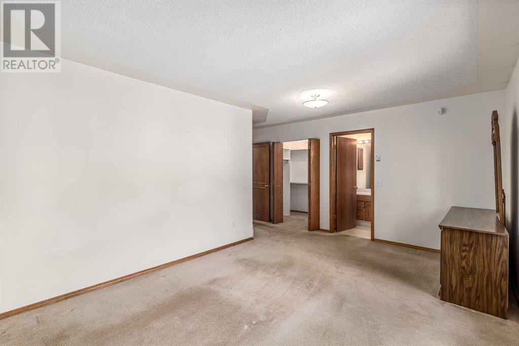 16 Sandalwood Close Nw, Calgary, Alberta  T3K 3Z4 - Photo 27 - A2228361