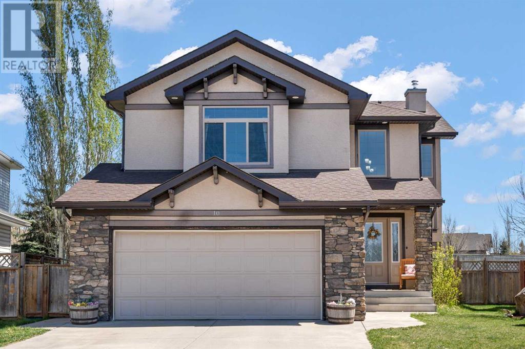 10 Crystalridge Bay Okotoks, Alberta Spend summer at the Lake! Beautifully presented 4 bedroom home with Air conditioning in a quiet cul de sac with Lake access. This awesome home has lots of upgrades, a pie shaped lot and must be viewed to be appreciated. As you walk in you are wowed by the open to above entrance and the abundance of natural light. Upon entering the home, you will appreciate the fabulous kitchen with stained maple cabinets to the ceiling, large island with raised eating bar, upgraded stainless steel appliances including a gas stove with double oven, corner pantry and modern backsplash. Entertain in the vaulted dining room with patio doors leading to the large low maintenance deck - perfect for BBQs! Relax in the spacious living room which features hardwood floors, corner stacked stone fireplace, in floor heating on this level and built in speakers. Completing the main floor is a laundry room and a half bath. On the 2nd level there are 3 good sized bedrooms, the master has a large walk in closet and a lovely 5 piece ensuite. There is a large bonus room with west views and a 4 piece family bathroom. In the fully finished basement is a 3 piece bathroom, a massive family/games room., another good sized bedroom and a playroom. The large pie shaped rear yard features an outdoor fireplace (perfect for making smores), a low maintenance deck, Hot tub "as is", storage shed and lots of room for a trampoline etc. This home benefits from being in the lake community with all its amenities, skating, swimming, boating, fishing etc. Did I mention the speaker system throughout the main areas? This home really does show beautifully and should be viewed to be appreciated. View 3D tour/multimedia/virtual tour. (id:48254)