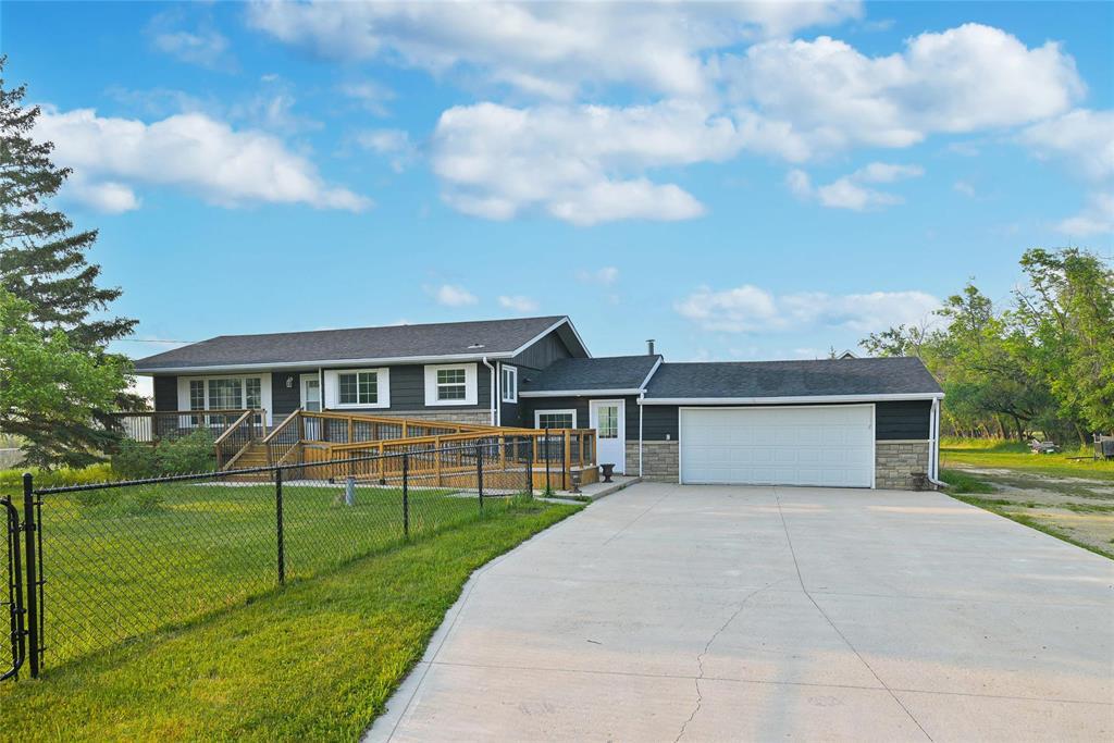 180 Paul Boulevard Winnipeg, Manitoba 2M//Winnipeg/Offers as Received.This beautifully updated 1,070+ sq ft bungalow offers 5 bedrooms, 2.5 bathrooms, and a fully finished basement, perfect for families seeking space, comfort, and country living. Situated on a private 5-acre lot, the home features numerous upgrades including newer windows, flooring, kitchen cabinets, roof, septic tank & pump, water pressure system with reverse osmosis, and a concrete driveway. A standout feature is the 36'x30' workshop with 220V wiring, front and rear 16'x9' electric overhead doors, and a fully finished second-story loft, ideal for a home business, studio, or storage. Outdoors, enjoy your own man-made pond with a sand beach, perfect for summer relaxation and recreation. The property is gated and includes a fenced front yard and substantial fenced area in the backyard, offering space and security for kids, pets, or livestock. This is a rare opportunity to enjoy country living just minutes from town, with all the amenities already in place. (id:48254)