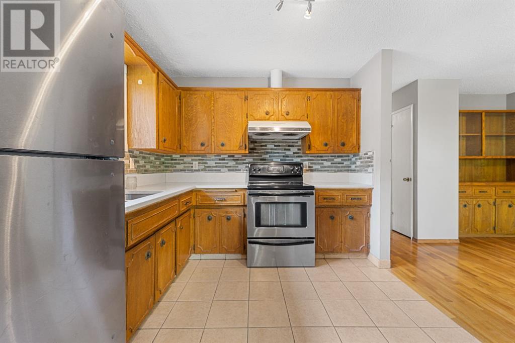 107 Beacham Way Nw, Calgary, Alberta  T3K 1R9 - Photo 11 - A2228761