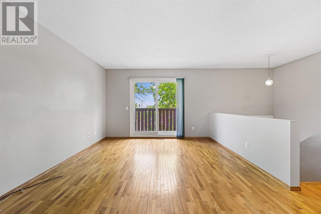 107 Beacham Way Nw, Calgary, Alberta  T3K 1R9 - Photo 7 - A2228761
