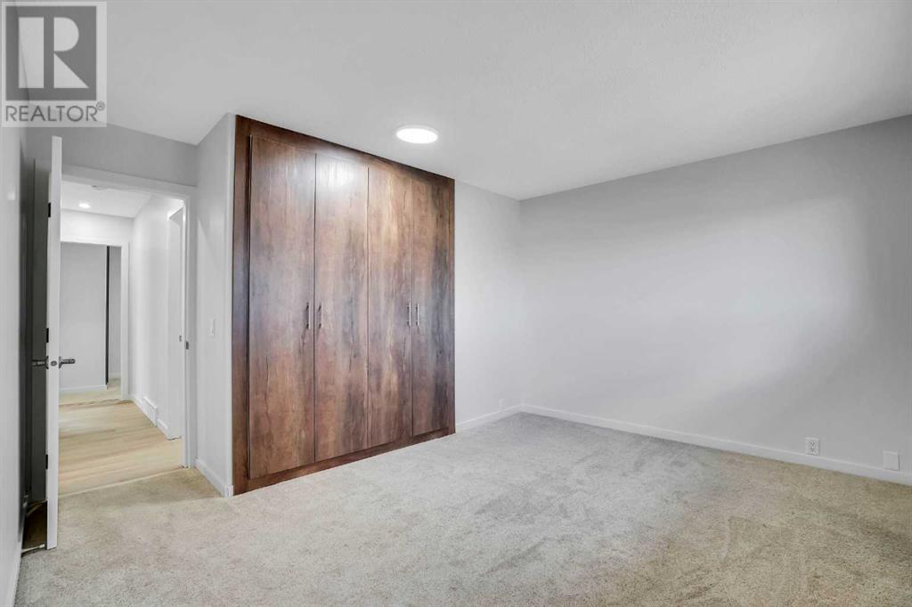 479 Berkley Crescent Nw, Calgary, Alberta  T3K 1A9 - Photo 7 - A2214697