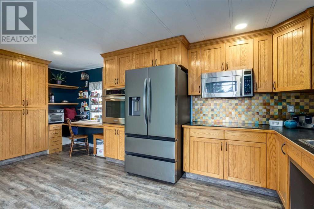 223 Huntwell Road Ne, Calgary, Alberta  T2K 5V4 - Photo 4 - A2216042