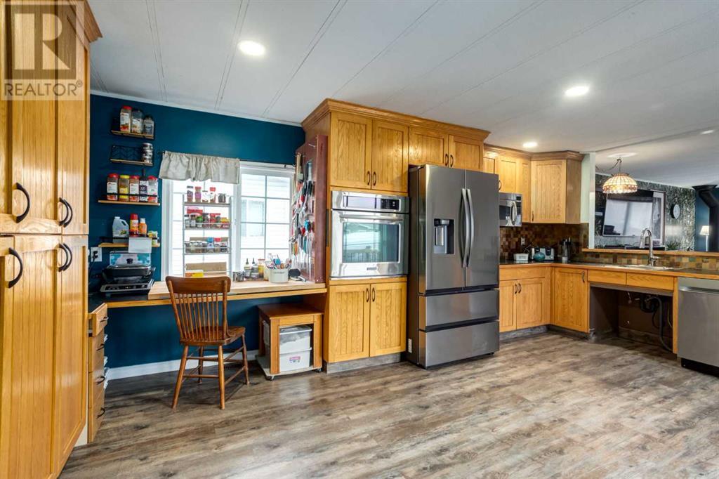 223 Huntwell Road Ne, Calgary, Alberta  T2K 5V4 - Photo 3 - A2216042