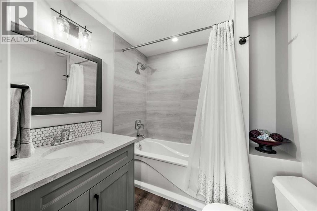 87 Hidden Creek Point Nw, Calgary, Alberta  T2A 6J7 - Photo 32 - A2227150