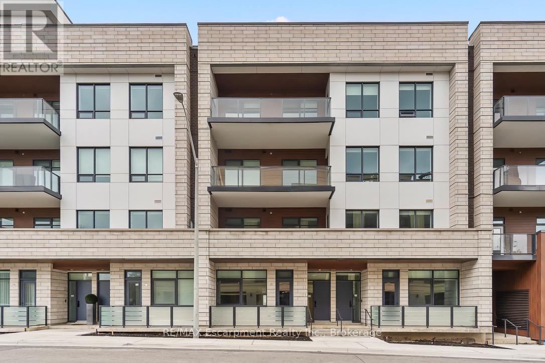 104 - 123 Maurice Drive, Oakville, Ontario  L6K 2W6 - Photo 2 - W12213690