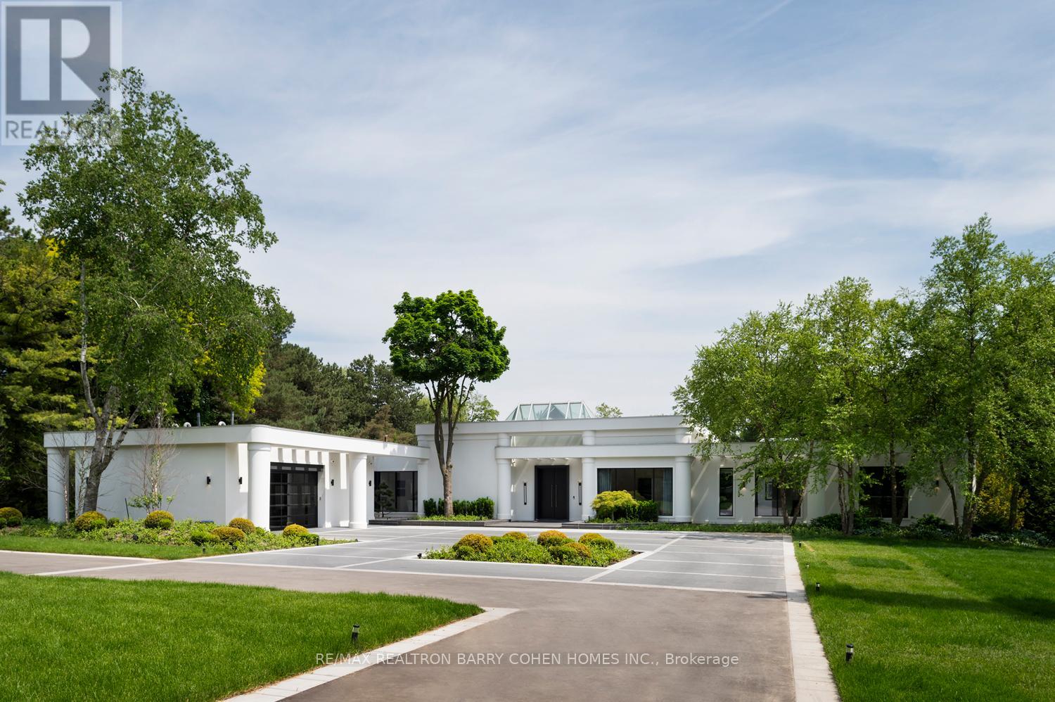 45 Park Lane Circle Toronto (Bridle Path-Sunnybrook-York Mills), Ontario Welcome To An Exceptional Private Gated Modern Estate, Extensively And Exquisitely Remodeled In 2024 And Nestled Within The Iconic Bridle Path Neighborhood. Sprawling Across 3 Acres And Boasting A 300-Foot Wide Frontage, This LA-Style Estate Offers An Unparalleled Level Of Sophistication With 17,000 Square Feet Of Living Space. Designed And Constructed By Tina Barooti/Tiarch Architect, Recipient Of The American Canadian Property Awards, This Residence Epitomizes Luxury Living. Enjoy The Epitome Of Outdoor Recreation With A Private Tennis Court, A Swimming Pool, And A Jacuzzi. The Ultra-Premium Concrete, Steel, Glass, And Stone Build Is Adorned With Skylights Featuring Shades, Illuminating The Space With Natural Light And Highlighting Magnificent Architectural Embellishments. Additional Amenities Include Glass Elevators, A Theatre Room, A Fully Equipped Gym, A Spa With A Steam Room, A Bar, And A Wine Cellar. The Estate Features Engineered Hardwood Imported From Europe. Practical Luxury Meets Timeless Elegance With A Heated Driveway And Impeccable Finishes Throughout The Property. (id:48254)
