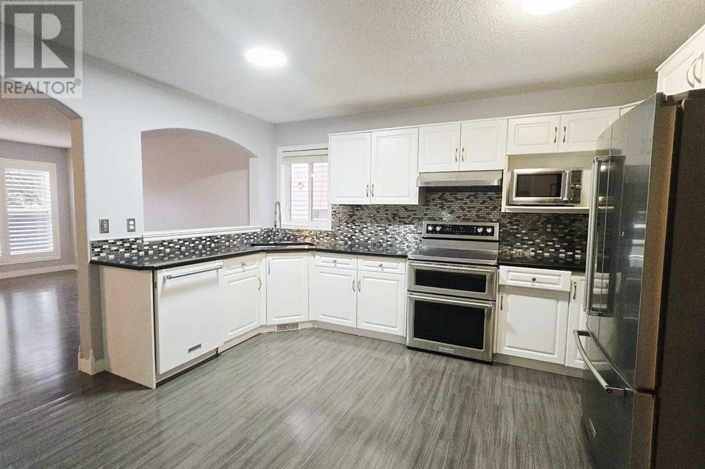 7915 Wentworth Drive Sw, Calgary, Alberta  T3H 4P2 - Photo 10 - A2226100