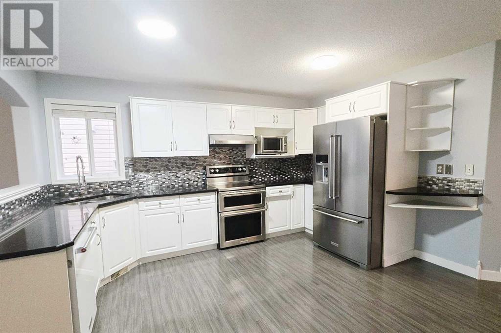 7915 Wentworth Drive Sw, Calgary, Alberta  T3H 4P2 - Photo 6 - A2226100