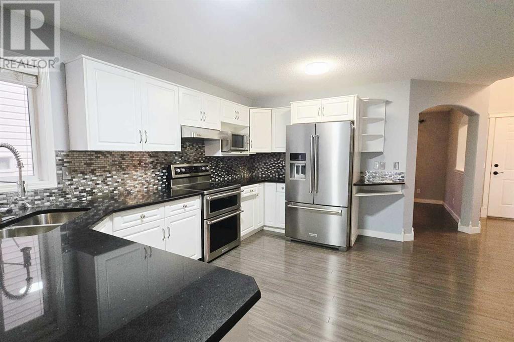 7915 Wentworth Drive Sw, Calgary, Alberta  T3H 4P2 - Photo 9 - A2226100