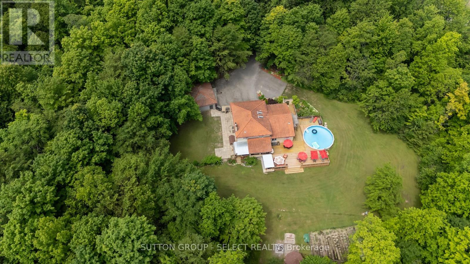 40979 Major Line St. Thomas, Ontario Welcome to Your Private Oasis Just Minutes from London!This beautifully maintained split-level home, built in 1988, sits on nearly three acres of private, treed, and landscaped grounds the perfect blend of serenity and convenience, just minutes outside of London.Step inside to discover an open-concept main floor featuring a renovated kitchen footprint, ideal for entertaining and everyday living. The spacious family room boasts a cozy fireplace and built-in bar, creating the perfect spot to relax or host guests.This versatile home offers 4+1 bedrooms, including a generous primary bedroom with ensuite, and a total of 4 bathrooms. The lower-level apartment with a separate entrance through the garage is ideal for multi-generational living or rental income.Enjoy summers in style with a large wrap-around deck, above-ground pool, and a fabulous outdoor kitchen an entertainers dream!Extras include updated mechanicals, a 731 sf heated workshop, dog kennel, and 400sf insulated shed everything you need for country living with city convenience.Don't miss this rare opportunity to own a spacious, move-in-ready home with incredible outdoor living and income potential all in a tranquil, park-like setting. (id:48254)