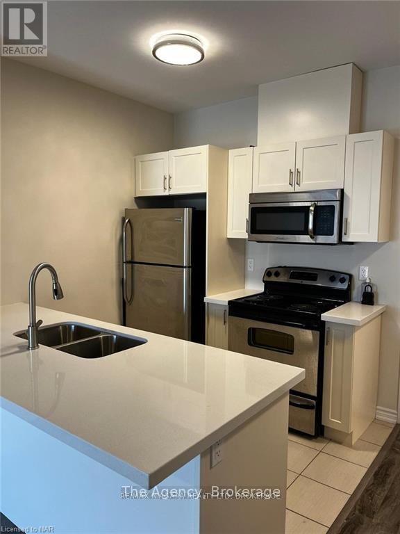 208 - 1370 Costigan Road, Milton (Cl Clarke), Ontario  L9T 0Y8 - Photo 7 - W12219122
