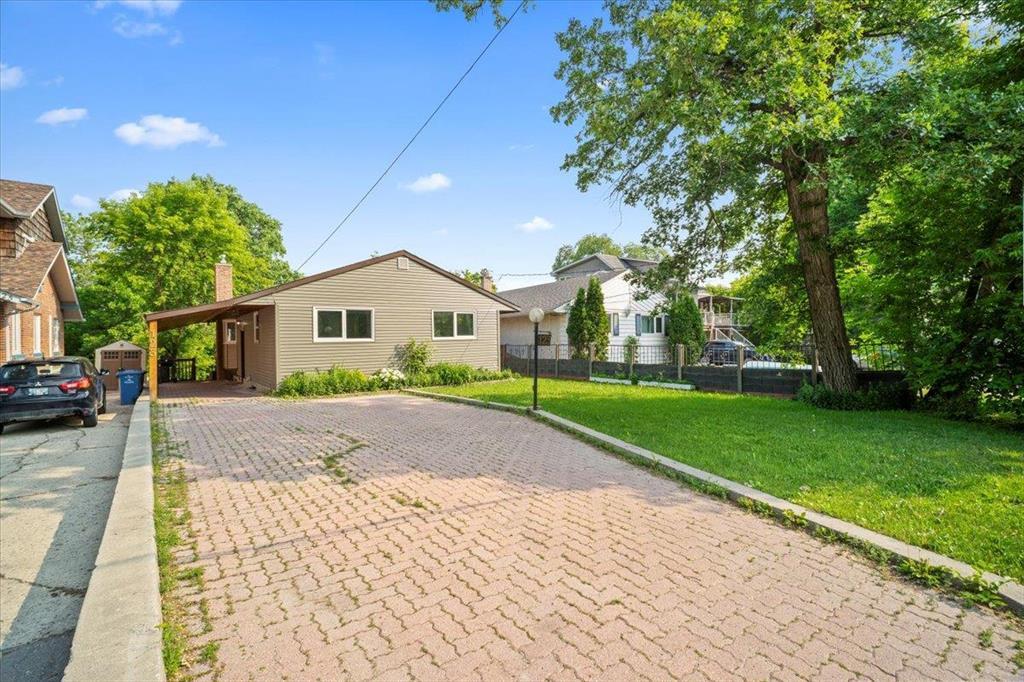 123 Kingston Row Winnipeg, Manitoba 2C//Winnipeg/Offers ANYTIME | KINGSTON ROW RIVERFRONT!! Rare chance to own on prestigious Kingston Row! This beautifully updated 1,100 sq ft bungalow sits on a 43x170 riverfront lot and has been extensively upgraded top to bottom. Major items are done: Windows ('21), shingles ( 14), HE furnace ( 13), HWT ( 22), and central air ( 05). Inside, you ll love the open-concept layout with a modernized kitchen, updated cabinets, hardwood floors, and stunning floor-to-ceiling windows with breathtaking river views! Originally a 3-bed layout, the main floor now features 2 spacious bedrooms and a fully renovated 3pc bath can be converted back to 3 beds if desired. The fully finished basement includes a cozy rec room, additional bedroom (buyer to verify egress), office, and another updated 3pc bath. Updates include paint, flooring, trim, lighting, and plumbing throughout. Outside, enjoy a double front driveway with carport and a 13x25 deck surrounded by mature trees for privacy and river serenity. A true gem!! (id:48254)