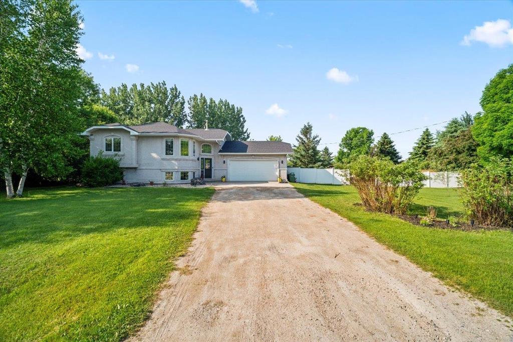 21 Deerfield Trail Steinbach, Manitoba R16//Steinbach/Offers as received. Bright, updated, and built for family living! Step inside to a welcoming entrance with a cozy built-in bench and wall hooks perfect for coats, boots, and bags. You re greeted by a bright, open main floor living area with large front windows. The spacious living room flows into the kitchen, offering plenty of space to cook, gather, and entertain.This home features 4 bedrooms and 2 fully updated 4-piece bathrooms, with 2 bedrooms and a bathroom on each level ideal for families, guests, or a home office. Updated flooring runs throughout, giving the home a fresh, modern feel. The finished lower level includes a built-in climbing wall and jungle gym an incredible indoor play space for kids.Outside, the massive half-acre fenced yard is a true retreat. Relax or host on the expansive two-tier deck, roast marshmallows around the fire pit, or watch the kids play on the play structure. Plus, a neighborhood playground is just a short walk away perfect for active families. (id:48254)
