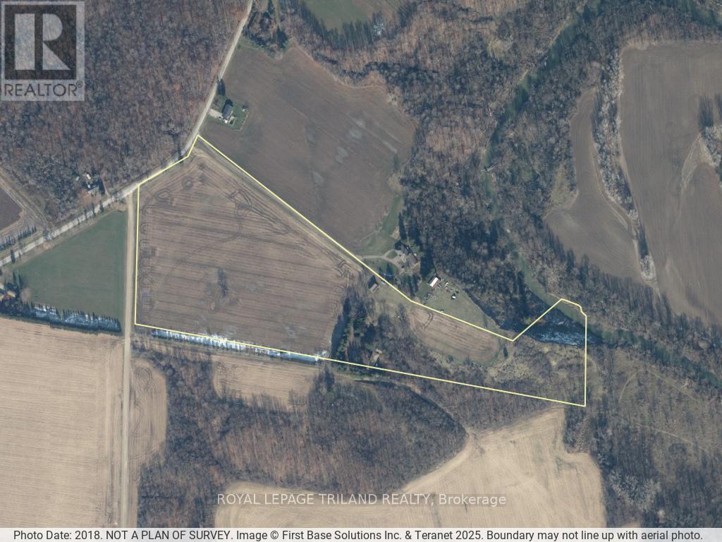 39339 Bush Line St. Thomas, Ontario Rare chance to own 26.5 picturesque acres on Bush Line within St. Thomas boundaries just 5kms from downtown with easy access to London, Port Stanley & Hwy 401. The property features approx. 17 acres of workable farmland and 9 acres of woods, ravine and land surrounding a spacious 6-bedroom, 2-bathroom brick ranch and two outbuildings set back off the road. A long private driveway leads to the original-owner brick ranch, nestled among mature trees with scenic ravine views in the backyard. With over 2,000 sq. ft. above grade, this home offers space and flexibility with its unique sprawling layout ideal for updating, personalizing, or accommodating multi-generational living. It features 6 bedrooms, 2 full baths with two sets of front and backyard door accesses, and two stairwells to the separated lower levels with many large windows. There are 2 furnaces and 2 water heaters. Outbuildings include a shed, a 19 x 26 garage with hydro, concrete floors, and a loft, plus a 20' by 26' workshop. Enjoy peaceful country living without sacrificing city convenience; your rural dream is close to everything. (id:48254)