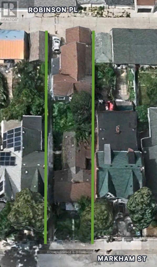 This is a goldmine. Two detached houses on one huge lot. Fronting on both, Markham Street and Robinson Place. As you imagine how this prime Queen West property could be developed, you will recognize the need to act quickly and secure it. Picture a stunning 4000sf modern masterpiece... or two seperate buildings... or a multi-unit development... or.... (id:48254)