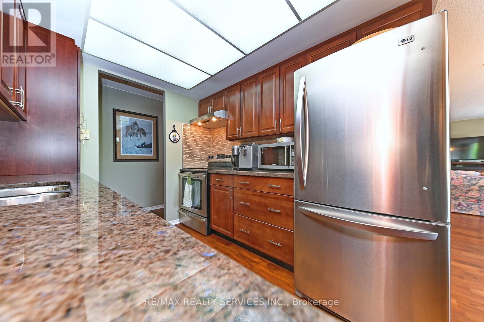 402 - 58 Church Street E, Brampton, Ontario  L6V 4A8 - Photo 12 - W12240415
