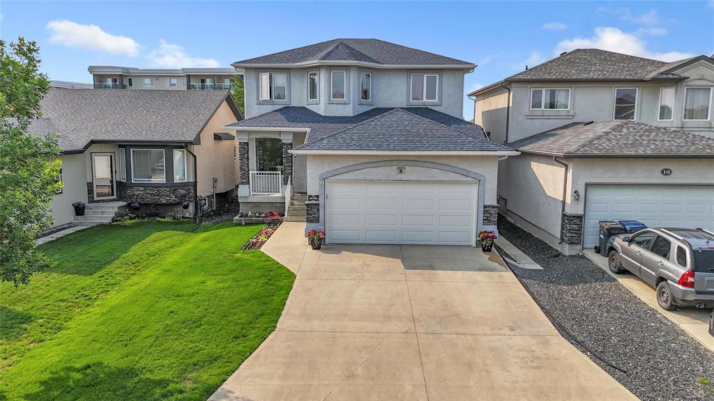 14 Lou Peltier Crescent Winnipeg, Manitoba 3K//Winnipeg/OFFERS ANYTIME. Situated on a peaceful street in the highly desirable Kildonan Green neighborhood, this beautiful two-story residence boasts five bedrooms and three and a half bathrooms. The main floor welcomes you with a bright great room featuring a gas fireplace, custom built-in entertainment center, and ceiling speakers. The kitchen is designed for the home chef, with granite countertops, ceramic tile backsplash, a large island, chimney hood fan, and a corner pantry and the adjacent breakfast nook overlooks the deck and fully fenced backyard. A convenient main floor laundry and a half bathroom complete this level. Upstairs, there are three spacious bedrooms, including a large primary suite with a luxurious ensuite bathroom that offers double sinks, a jetted tub, separate shower, and walk-in closet. Fully finished basement adds two more bedrooms, a full bathroom, and a generous recreation room great for guests or growing families. Highlights include a double garage, elegant spindled staircase, central AC, and central vacuum. Shingles (2025), Flooring(2020) & many more recent upgrades. Measurements +/- jogs. Shows A++. Must view! (id:48254)