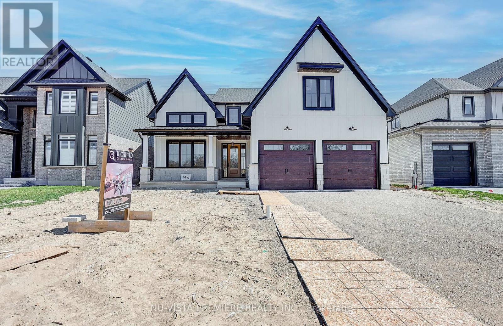 Lot 14 Harvest Lane Thames Centre, Ontario TO BE BUILT! This stunning 3,375 sq. ft. modern farmhouse from Richfield Custom Homes perfectly blends warmth, luxury, and functionality. Located in the highly sought-after Boardwalk at Millpond community in Dorchester, this model home showcases top-tier craftsmanship, thoughtful design, and premium finishes throughout. Step inside to soaring 18-ft ceilings in the great room, where floor-to-ceiling windows bathe the space in natural light. The gourmet kitchen is a chefs dream with tons of storage and a butlers pantry that flows seamlessly into the dining room. The dining room is designed to impress, featuring soaring ceilings that create an open, airy atmosphere perfect for hosting intimate family dinners or grand celebrations. Thoughtfully placed windows allow natural light to cascade in, enhancing the home's inviting warmth and elegance. The main-floor primary suite is a true retreat, featuring two walk-in closets, a spa-inspired 5-piece ensuite, and direct access to the optional expansive covered back deck perfect for morning coffee or evening relaxation. Upstairs, four generously sized bedrooms offer incredible comfort. A secondary primary suite boasts its own 5-piece ensuite and walk-in closet, while two additional bedrooms share a Jack-and-Jill bath. The fifth bedroom enjoys its own private 3-piece ensuite, ensuring ultimate convenience for family and guests. Richfield Custom Homes specializes in crafting one-of-a-kind residences tailored to your lifestyle. Whether you're looking for modern elegance, timeless charm, or something in between, well bring your vision to life with exceptional craftsmanship and premium finishes. With exclusive lots available in Boardwalk at Millpond, now is the time to build the home you've always dreamed of. Don't miss your chance to own this exceptional model home or start planning your custom dream home today! (Photos from previous model) (id:48254)