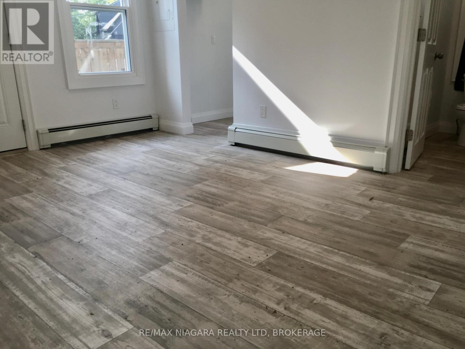 Rear Unit - 163 Welland Avenue, St. Catharines (Downtown), Ontario  L2R 2N9 - Photo 11 - X12245949