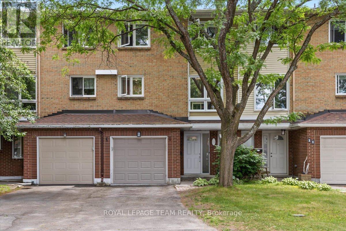 13 Kedgewick Court Ottawa, Ontario Welcome to this beautifully maintained three-story townhouse in the highly sought-after Tanglewood neighbourhood, offering the perfect blend of space, privacy, and convenience. Featuring large updated windows (2015 & 2023) that flood the home with natural light, this spacious residence includes 3 generously sized bedrooms, 2.5 bathrooms, and a smart, functional layout ideal for modern living. The renovated main level (2024) offers a versatile space perfect for a home office, gym, playroom, or family room, while the second floor boasts an open-concept living and dining area with a cozy wood-burning fireplace, and an updated kitchen (2021) complete with stainless steel appliances, ample cabinetry, and convenient in-unit laundry. The primary suite includes a private en-suite and walk-in closet, with two additional bedrooms and a full bath completing the upper level. Enjoy enhanced privacy with no rear neighbours, a large yard, garden shed and a spacious deck perfect for outdoor living. Located close to top-rated schools, shopping, parks, and transit, and with a roof replaced in 2017, this rare court-end unit offers comfort, style, and functionality in one of the areas most desirable communities don't wait, come see it today! 24 hours irrevocable on all offers as per form 244. (id:48254)