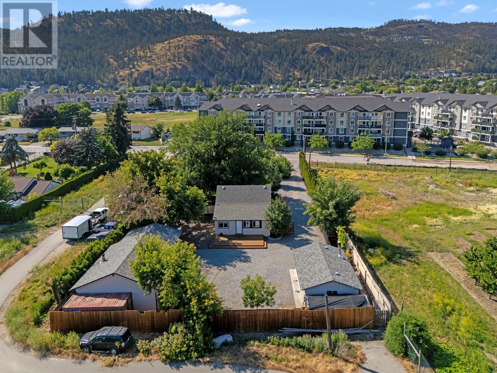 431 Valley Road Kelowna, British Columbia The Hobbyist’s Dream! This one-of-a-kind property offers abundant parking, multiple detached shops, and exceptional convenience. Situated in desirable Glenmore, this property is just shy of 0.6 of an acre and offers the perfect blend of character, functionality, and privacy in one of Kelowna’s most sought-after neighbourhoods. Backing onto ALR land and peaceful orchards, you’ll enjoy serene views of greenery, rather than your neighbour's house. The renovated 3-bedroom, 3-bathroom character home is full of charm and tasteful upgrades. With a thoughtfully designed layout, modern finishes, and inviting outdoor spaces, you’ll feel right at home while enjoying the best of the Okanagan lifestyle. What truly sets this property apart are the two large, insulated, detached shops, each with its own full bathroom, making it possible to for use as an in-law suite. Whether you're a hobbyist, entrepreneur, or tradesperson, the setup is ideal for a home-based business, creative studio, or secure equipment storage. The flat, fully usable property allows for ample parking — perfect for trucks, trailers, RVs, or work vehicles — making this a rare to find within the City. Nestled in the heart of Glenmore, you’re just minutes from top-rated schools, parks, shops, cafes, and downtown. It’s the perfect balance of urban access and rural peace — ideal for someone who is looking for versatility in a central setting. (id:48254)