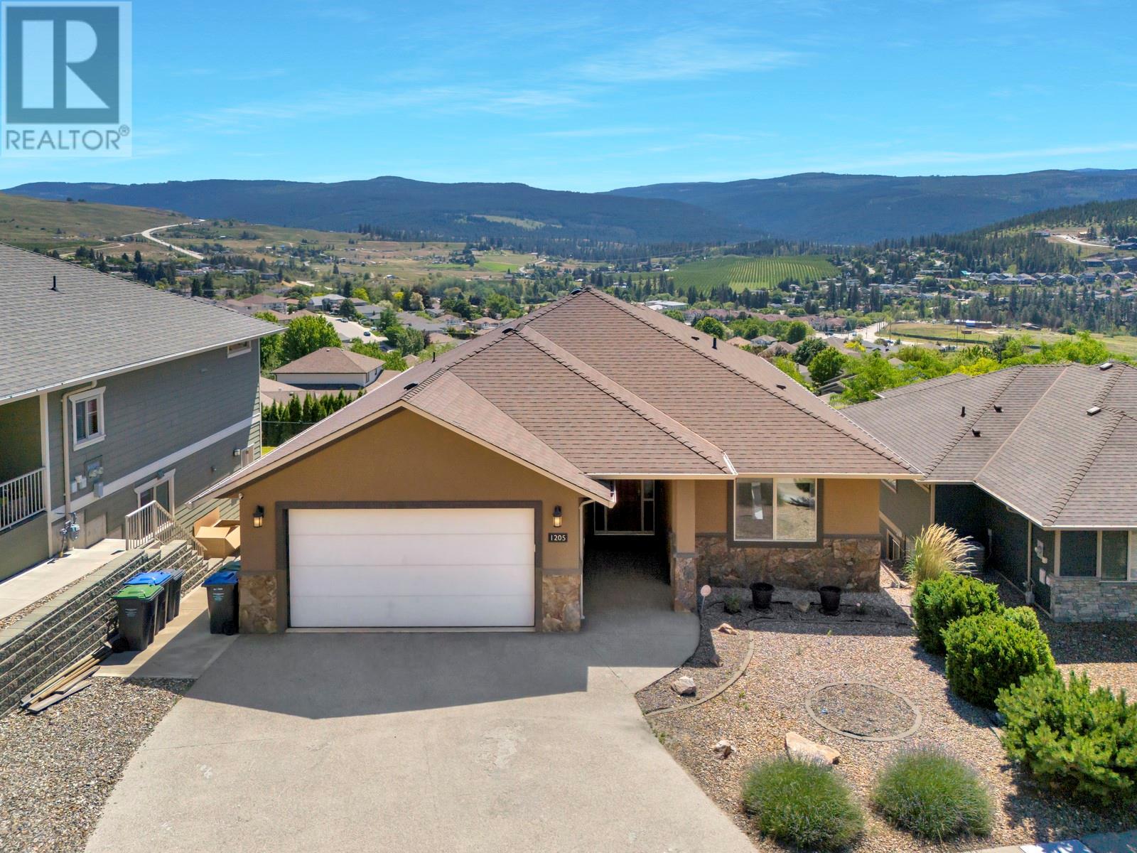 1205 Loseth Drive Kelowna, British Columbia Welcome to your dream family upgrade—this spacious 3,400+ sq ft home offers room for everyone, plus a mortgage helper that doesn’t cramp your style. With a legal suite that occupies just half the basement, you keep the lion’s share of the space for living, lounging, and letting the kids take over the rec room. Step out onto the large covered patio and soak in sweeping valley views—a perfect spot for morning coffees or post-bedtime wind-downs. Inside, you'll find a well-maintained, move-in-ready home with generous living spaces, 4 bedrooms, and 4 bathrooms that make daily life both easy and enjoyable. Tucked into a quiet, family-friendly neighbourhood just five minutes from shops, schools, and services, this home also gives you quick access to scenic hiking trails and peaceful surroundings. It’s the rare combo of practicality and lifestyle—perfect for the move-up buyer who wants space, serenity, and smart value. (id:48254)