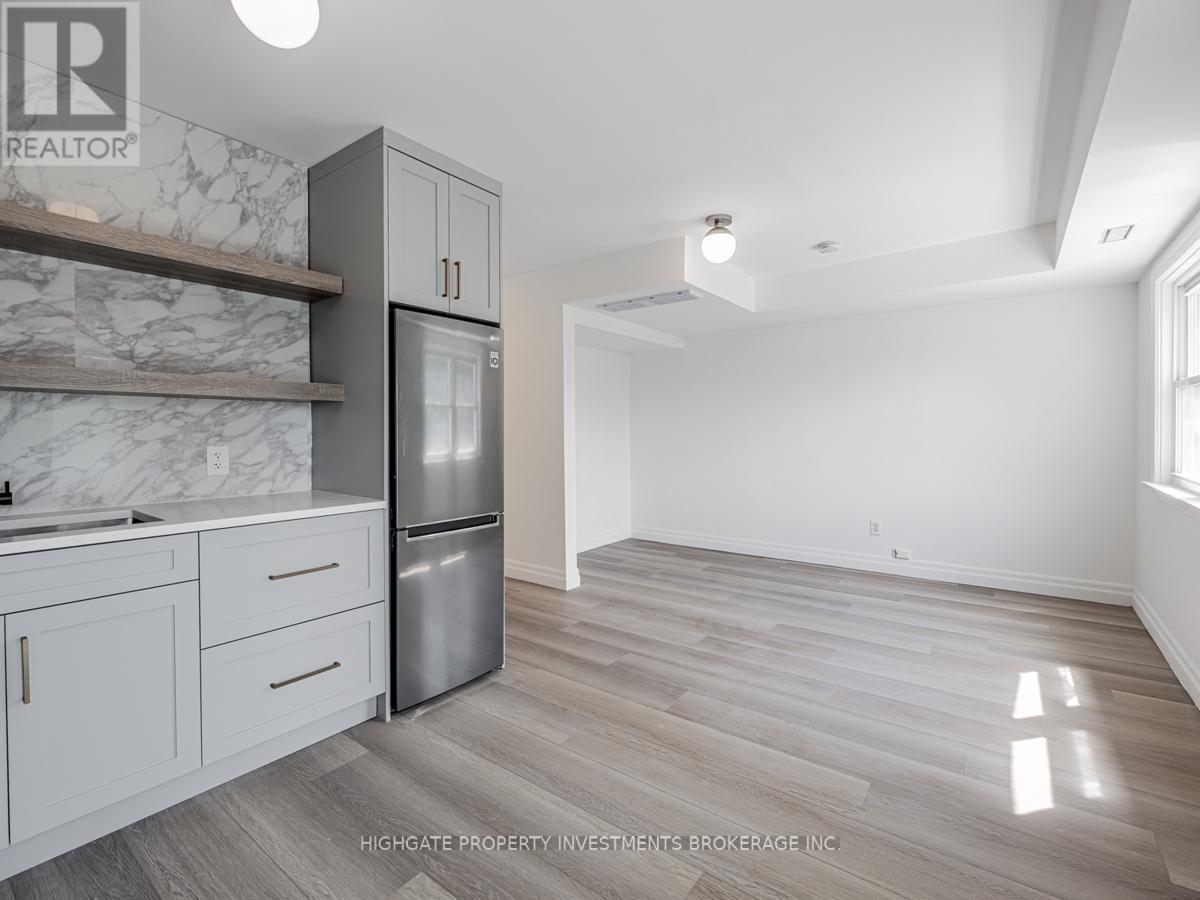 Back - 170 Ennerdale Road, Toronto, Ontario  M6E 4C9 - Photo 3 - W12274504