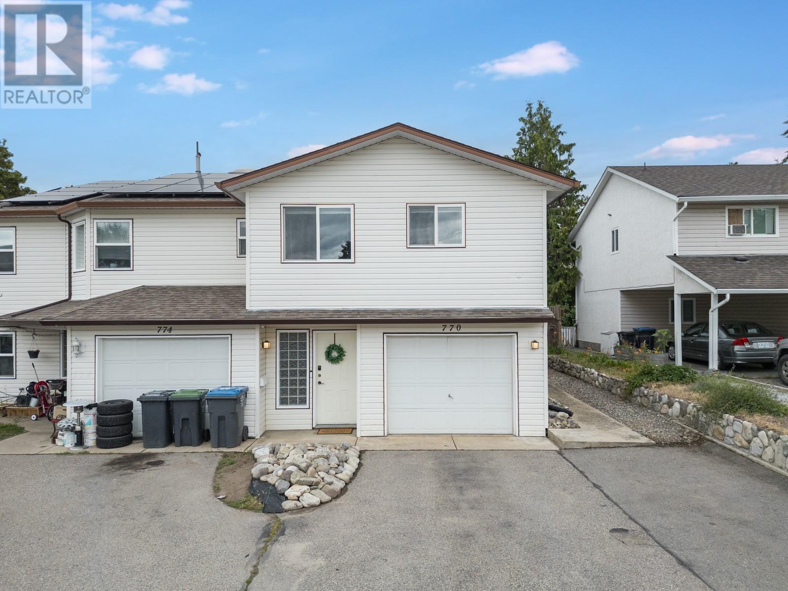 770 White Court Kelowna, British Columbia Welcome to 770 White Court, a bright, move-in ready half duplex at the end of a quiet cul-de-sac. Perfect for young families or investors needing extra income from the suited lower level. Inside, the open concept layout is great for everyday living and entertaining. The kitchen has all new appliances (2022) and flows into the dining and living area with a cozy gas fireplace. Light laminate flooring (2022) keeps the space feeling fresh and full of sunlight. The spacious primary bedroom has a 4-piece ensuite and walk-in closet, with one more bedroom and a den down the hall, one with a skylight. Step outside to your private deck, BBQ, and backyard, perfect for kids, pets, or relaxing under the included pergola. A/C was added in 2023 for year-round comfort. The suite downstairs has a separate entrance, full kitchenette, bright living area, its own bedroom, and side yard for BBQs. Shared laundry has a lock-off door to the main home and there’s room to add a range/oven. The attached single garage provides secure parking plus extra storage, and the cul-de-sac location means peace of mind with minimal traffic, great for kids to play. You’re minutes to schools, parks, transit, recreation, shopping, and just 15 minutes to both downtown and the airport. This is the one you’ve been waiting for, the perfect blend of family living and income potential, right in the heart of everything. Schedule your showing today! (id:48254)