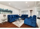 Living area featuring wood finished floors and recessed lighting