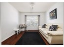 Living room with hardwood / wood-style floors and a textured ceiling