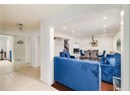 Living room with stairs, a chandelier, recessed lighting, and light tile patterned floors