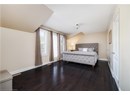 Bedroom featuring dark wood-style floors and a textured ceiling