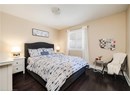 Bedroom with dark wood-style floors