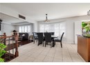 Dining area featuring light tile patterned floors and plenty of natural light