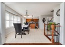 Dining space with plenty of natural light and light tile patterned floors