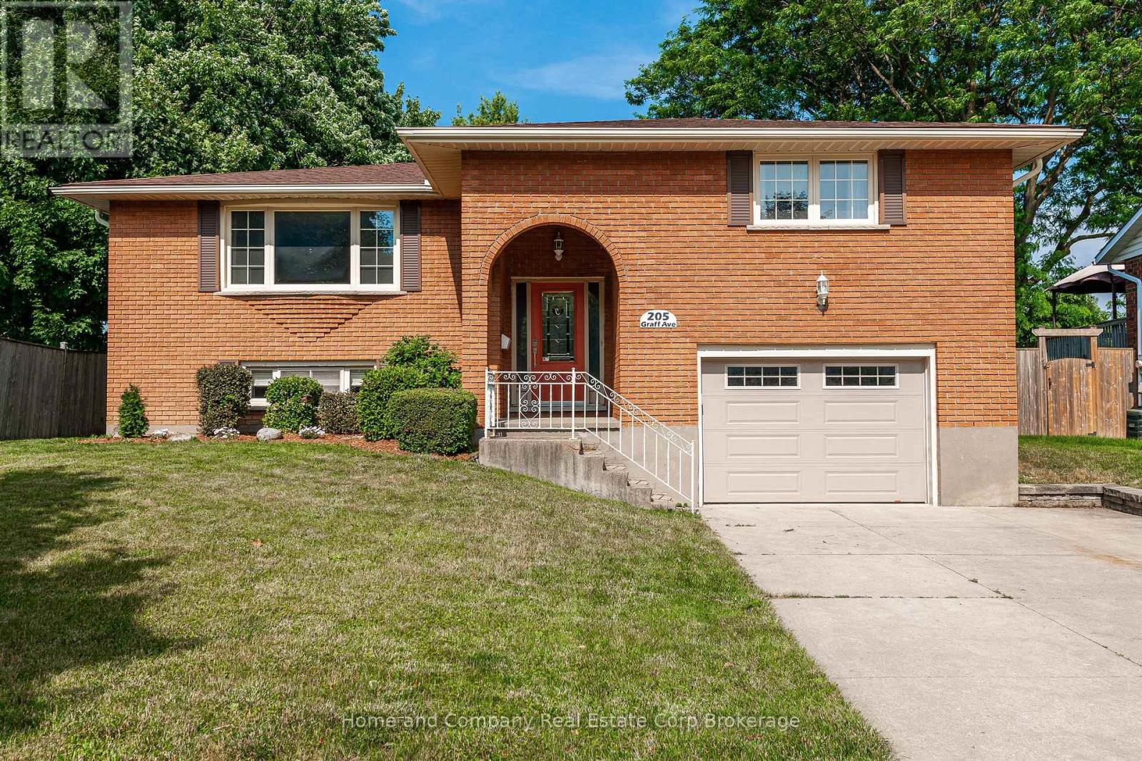 If you seek a property for your growing family, a place to build memories and truly feel at home, this residence might just hold the next chapter of your life!   Nestled in the heart of the desirable Bedford Ward, this exquisite 5 bedroom, 2 bath home exudes comfort while providing the living space you require.  More than meets the eye with 1850 square feet of living space on the main floor.  You are welcomed into the airy foyer which takes you up to the living and dining room.  3 bedrooms are on this level along with a newly renovated 4 piece bathroom and functional kitchen. Undoubtedly, the standout feature of this home, is the expansive sunroom addition with floor to ceiling windows. Step out onto the new deck and patio, where everyone can enjoy the large fully fenced back yard, offering freedom to play and explore. In the lower level, the recroom has overflow space for the kids' friends to gather and visit.  A convenient recently refreshed 3 piece bath serves the remaining 2 bedrooms boasting oversized windows.  A spacious laundry room and entry to the garage round out this level.  All new A/C, Central Vac unit, washer and dryer, water softener and carpet on the main floor; this home has been well cared for and now ready for a new family! (id:48254)